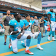 Michael Thomas #31 of the Miami Dolphins and Kenny Stills #10 of the Miami Dolphins take a knee during the national anthem prior to the game against the New York Jets at the Hard Rock Stadium on November 6, 2016 in Miami Gardens, Florida.